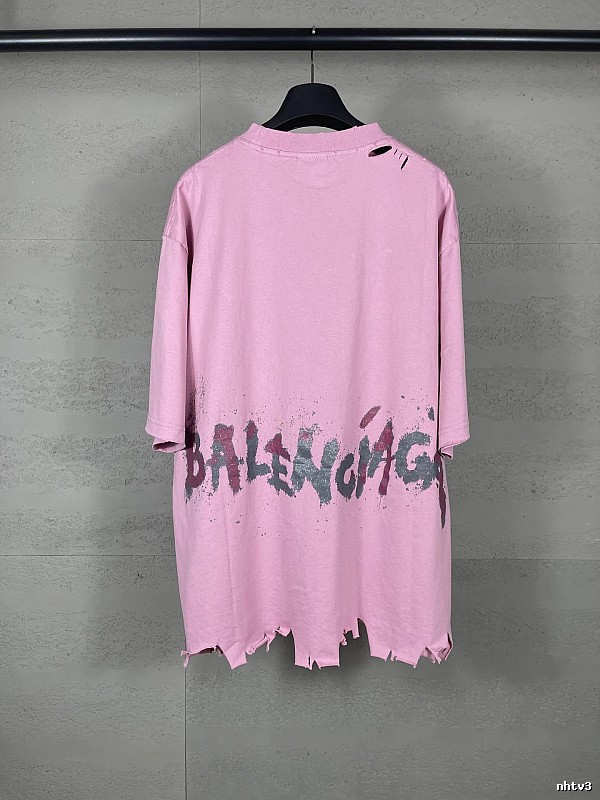 Balenciaga's pink T-shirt with a hole and graffiti style