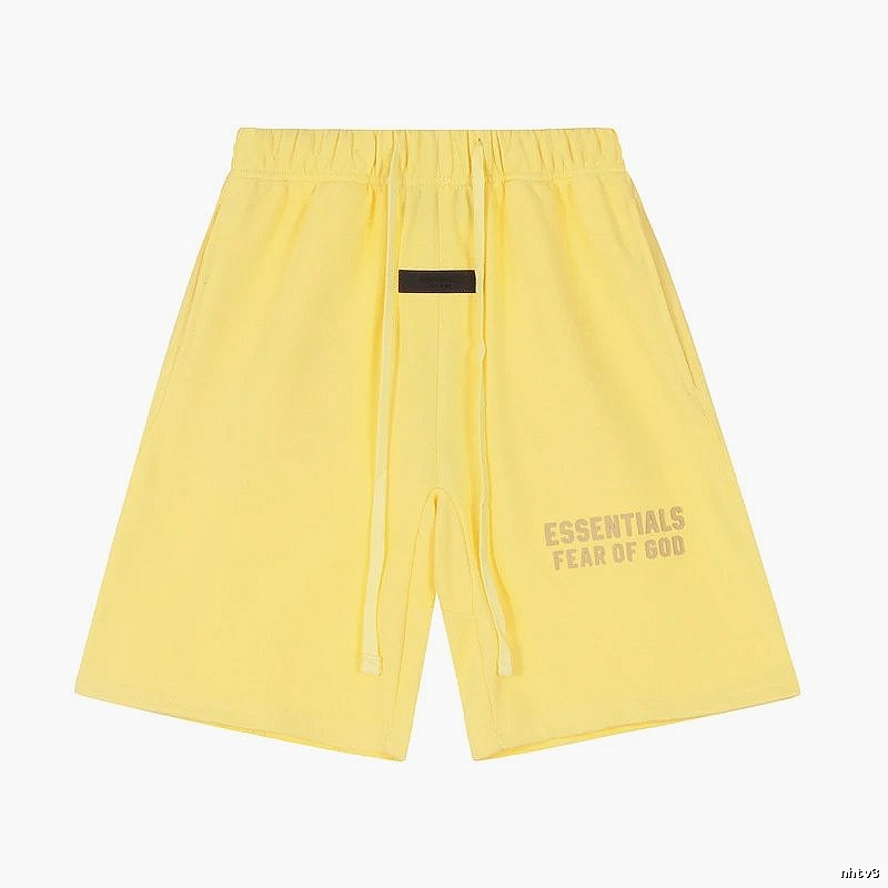 ESSENTIALS minimalist style yellow shorts